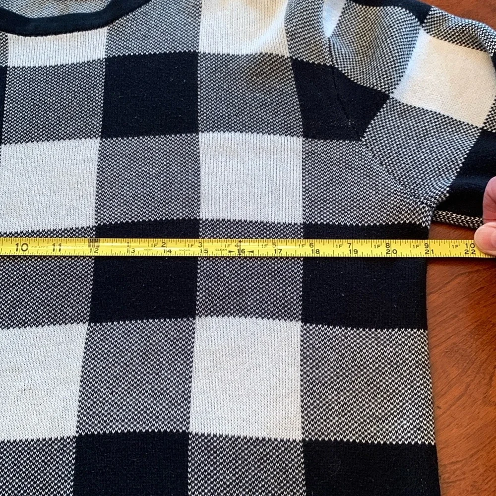 Divided Black and Cream Crewneck Sweater with Bold Check Pattern